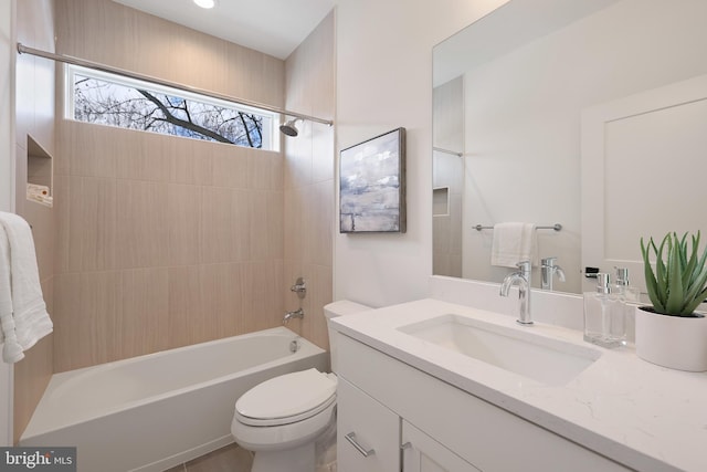 bathroom with toilet, washtub / shower combination, and vanity