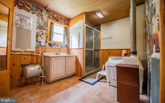 220 Gillens Rd, Mill Hall, PA 17751 - bathroom with a shower stall, wainscoting, vanity, wooden walls, and tile patterned floors