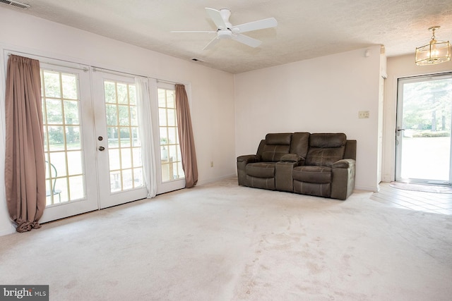 4801 Vesper Cir, Palmyra, NJ 08065 - living room featuring plenty of natural light, carpet flooring, french doors, ceiling fan, and a textured ceiling