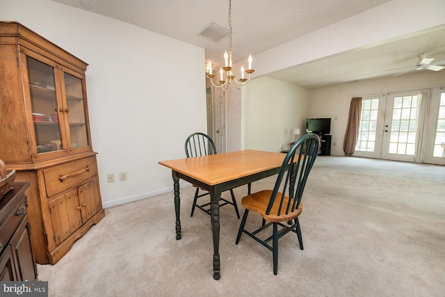 4801 Vesper Cir, Palmyra, NJ 08065 - dining area with light carpet, a ceiling fan, a chandelier, baseboards, and french doors