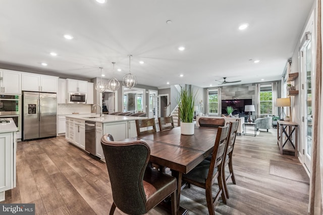 803 Rexford Way, Upper Marlboro, MD 20774 - dining space with recessed lighting, wood finished floors, a ceiling fan, stairs, and a chandelier