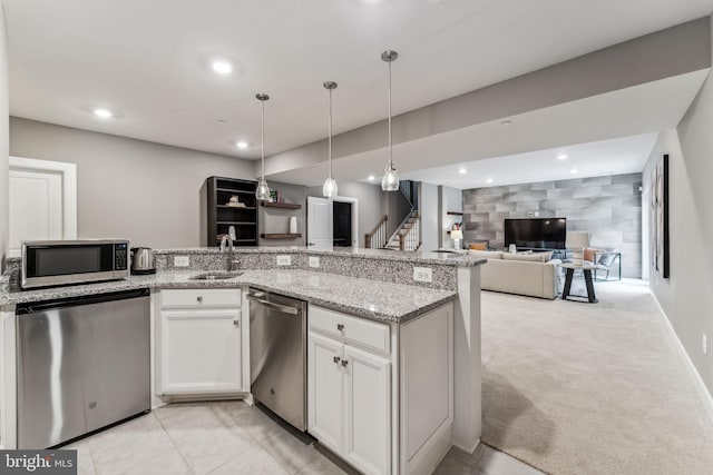 803 Rexford Way, Upper Marlboro, MD 20774 - kitchen with appliances with stainless steel finishes, a sink, open floor plan, light stone counters, and white cabinetry