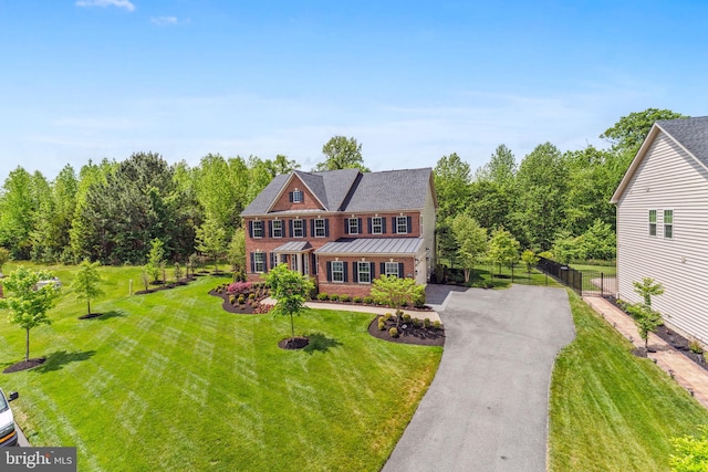 803 Rexford Way, Upper Marlboro, MD 20774 - view of front of home featuring asphalt driveway, a standing seam roof, and brick siding