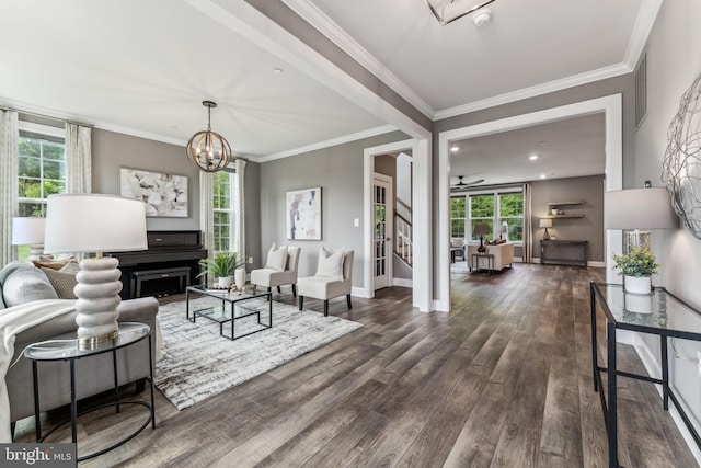 803 Rexford Way, Upper Marlboro, MD 20774 - living room featuring wood finished floors, plenty of natural light, a chandelier, ornamental molding, and baseboards