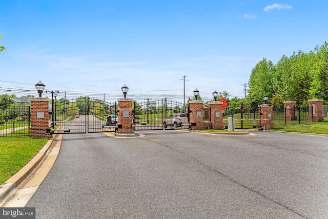 803 Rexford Way, Upper Marlboro, MD 20774 - view of asphalt street featuring street lighting, a gate, a gated entry, and curbs