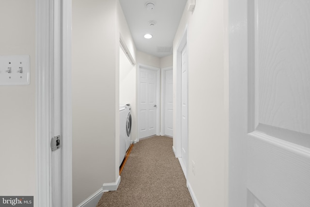 107 Bancroft Dr Unit 96, Fredericksburg, VA 22405 - hallway with washing machine and dryer, carpet flooring, and baseboards