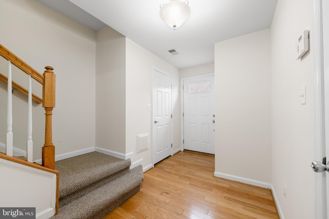 107 Bancroft Dr Unit 96, Fredericksburg, VA 22405 - hallway with stairs, light wood-style flooring, and baseboards