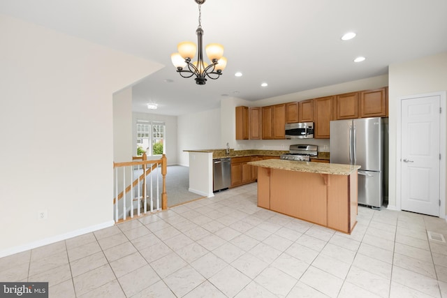 107 Bancroft Dr Unit 96, Fredericksburg, VA 22405 - kitchen featuring stainless steel appliances, a chandelier, recessed lighting, baseboards, and a center island