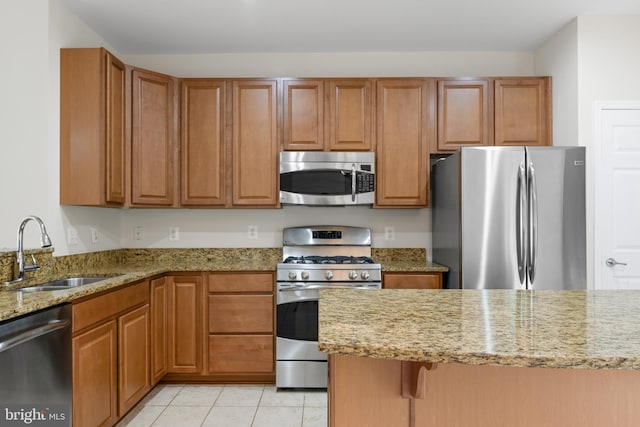 107 Bancroft Dr Unit 96, Fredericksburg, VA 22405 - kitchen with appliances with stainless steel finishes, a sink, light stone countertops, and light tile patterned flooring