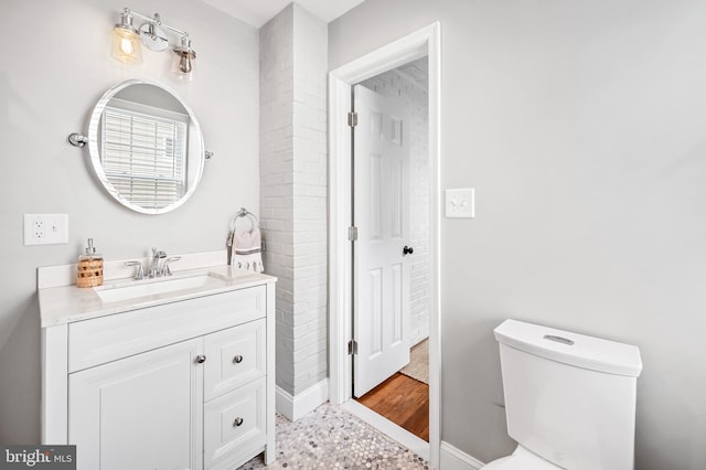 533 Park Ave, Towson, MD 21204 - bathroom with toilet, vanity, and baseboards