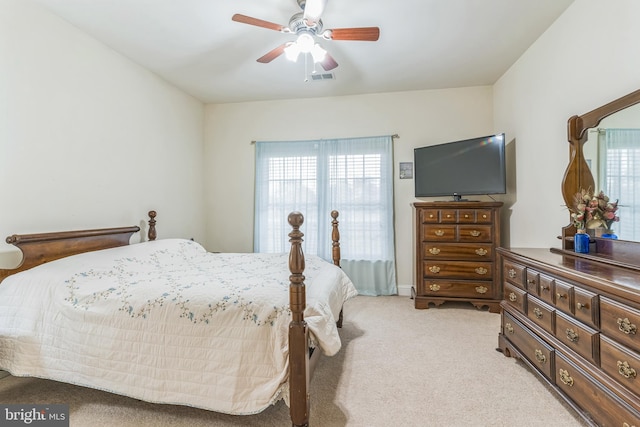 8200 Marshall Corner Rd, Pomfret, MD 20675 - bedroom featuring multiple windows, light carpet, and a ceiling fan