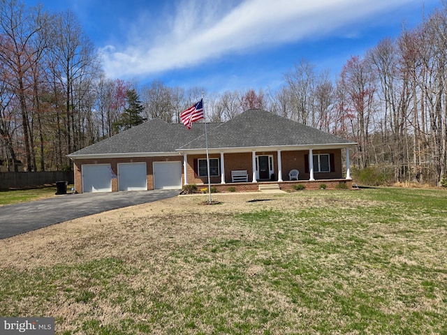 8200 Marshall Corner Rd, Pomfret, MD 20675 - view of front facade featuring driveway, a porch, a garage, and brick siding