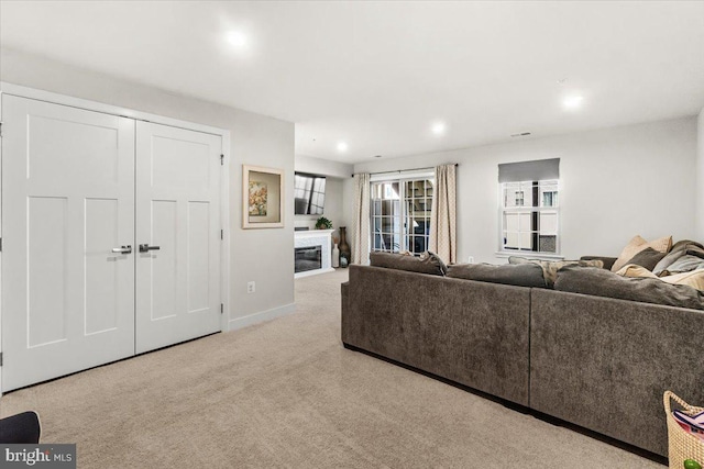 10732 Lamoka Ln, New Market, MD 21774 - living area with a glass covered fireplace, carpet, recessed lighting, and baseboards