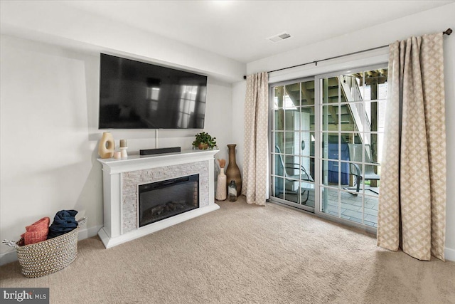 10732 Lamoka Ln, New Market, MD 21774 - living area featuring carpet, a glass covered fireplace, and baseboards