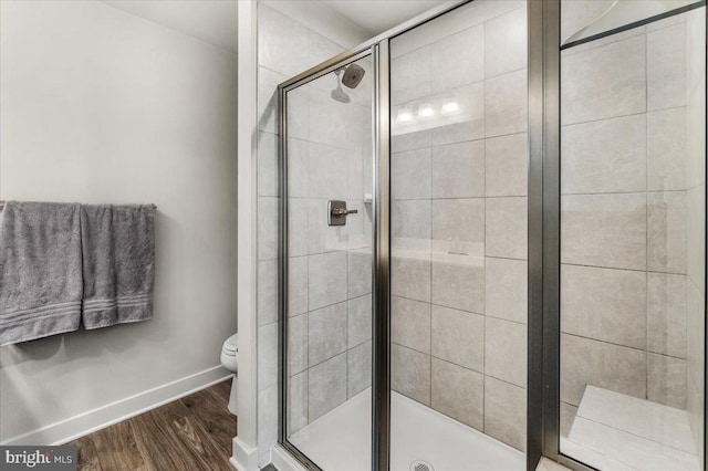 10732 Lamoka Ln, New Market, MD 21774 - full bathroom with a stall shower, wood finished floors, toilet, and baseboards