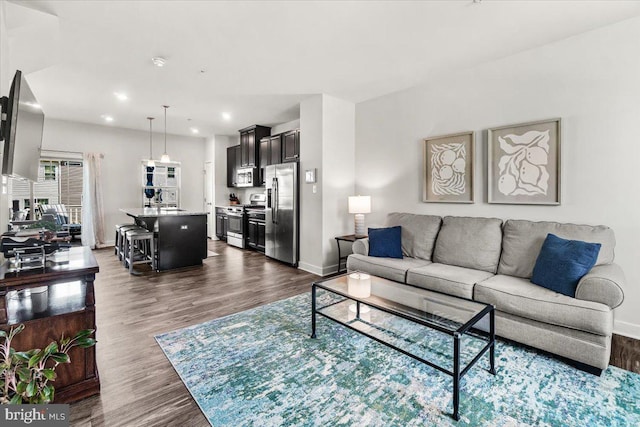 10732 Lamoka Ln, New Market, MD 21774 - living room featuring dark wood-style flooring, baseboards, and recessed lighting