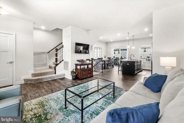 10732 Lamoka Ln, New Market, MD 21774 - living area featuring wood finished floors, stairway, recessed lighting, and baseboards