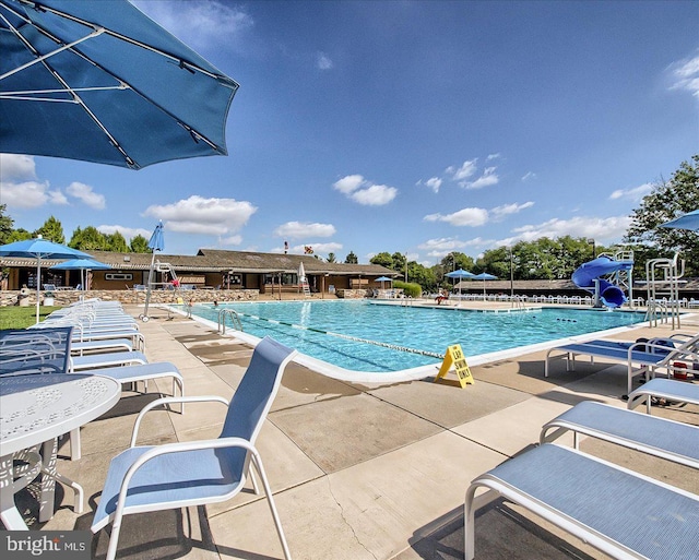 10732 Lamoka Ln, New Market, MD 21774 - community pool featuring a water slide and a patio area