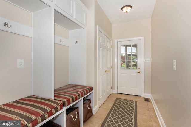 mudroom with light tile patterned floors