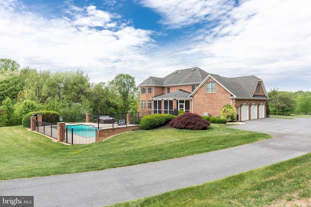 view of pool featuring a sunroom