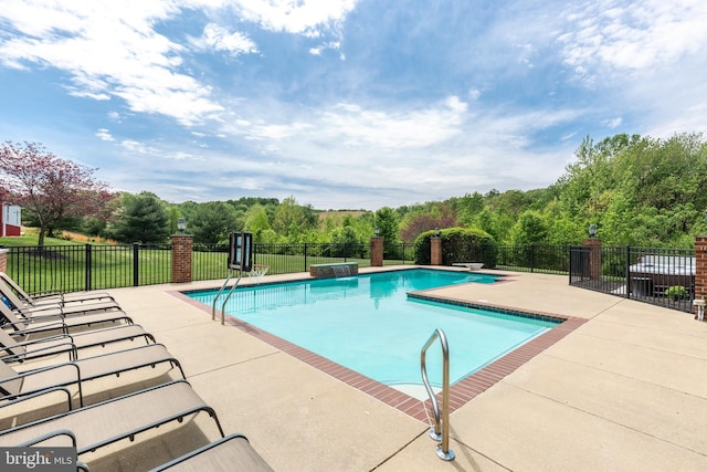 view of pool with fence and a patio area