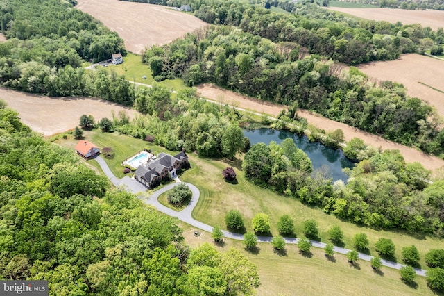 aerial view of sparsely populated area featuring a nearby body of water