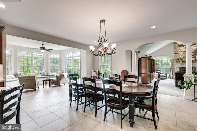 dining area featuring decorative columns, arched walkways, light tile patterned flooring, recessed lighting, and ceiling fan