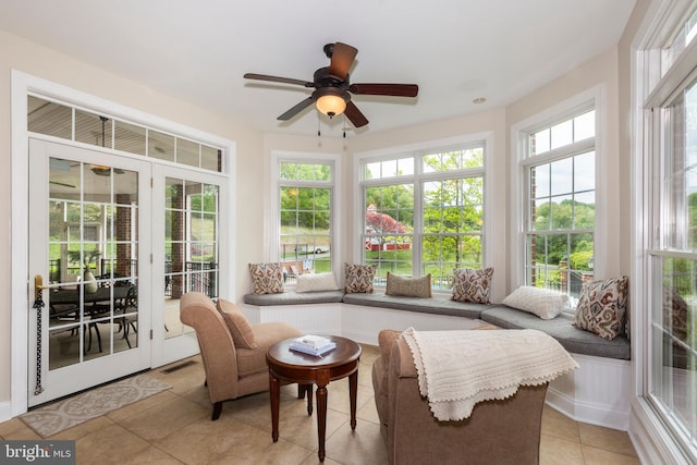sunroom featuring french doors and tile patterned floors