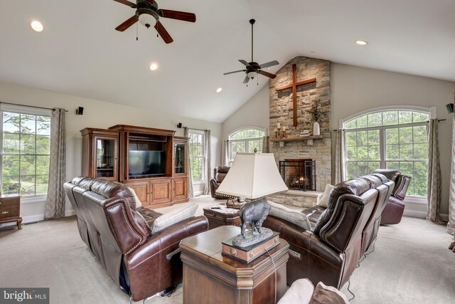 living room with a ceiling fan, light colored carpet, healthy amount of natural light, recessed lighting, and high vaulted ceiling