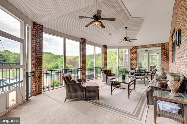 sunroom / solarium with an outdoor hangout area, ceiling fan, and lofted ceiling
