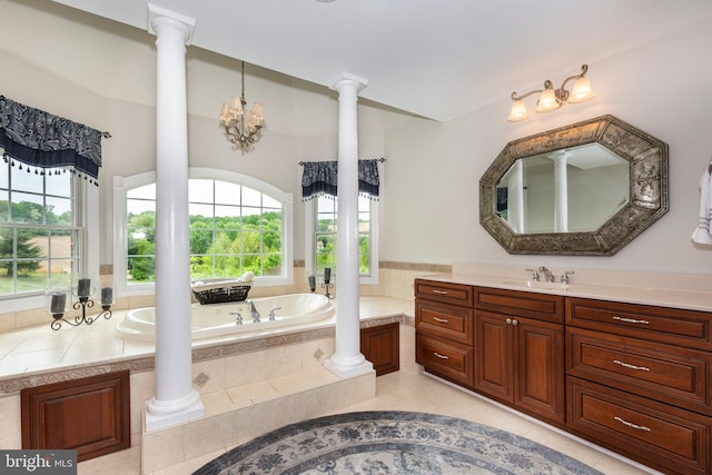 full bathroom featuring plenty of natural light, a garden tub, tile patterned floors, and vanity