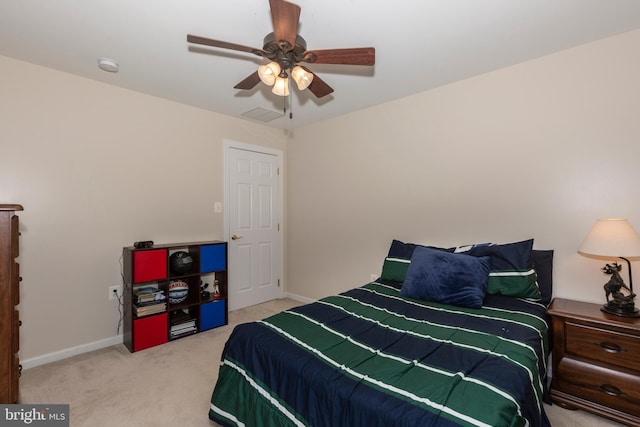 bedroom with carpet, ceiling fan, and baseboards