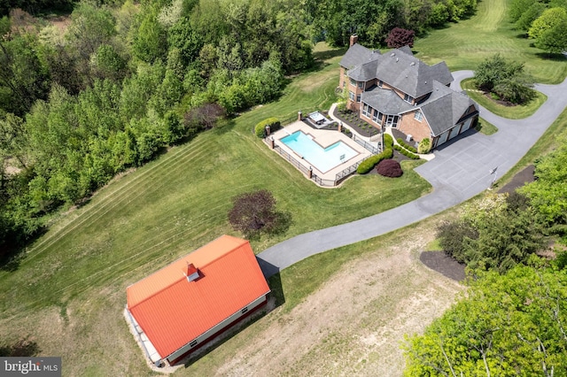 view of subject property with a pool area