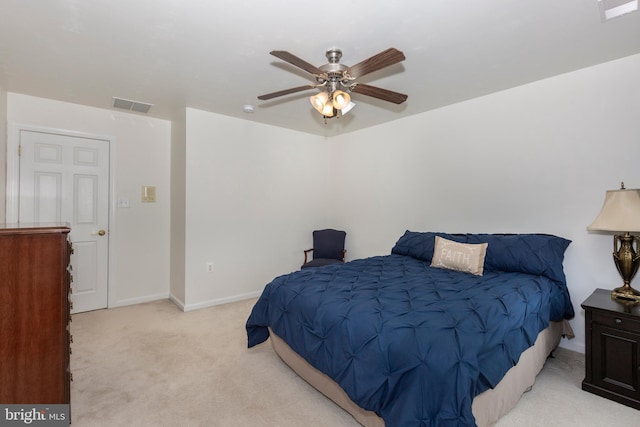 carpeted bedroom featuring baseboards and ceiling fan