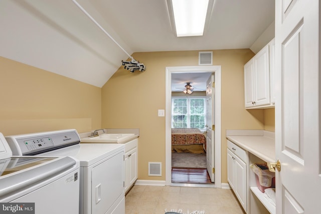 laundry area featuring washer and clothes dryer, cabinet space, light tile patterned flooring, baseboards, and ceiling fan