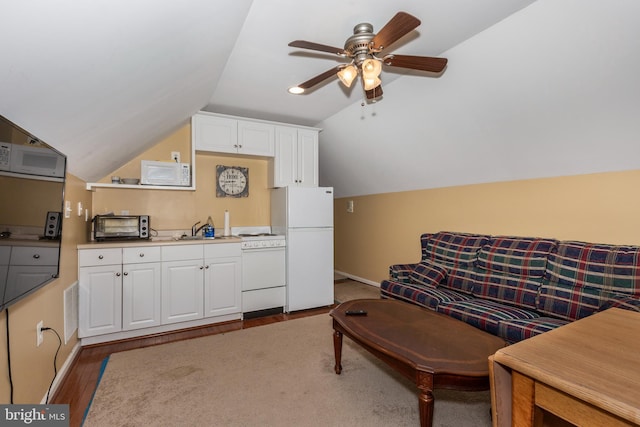 living area with lofted ceiling, baseboards, a ceiling fan, and wood finished floors