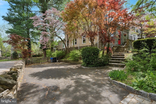 exterior space with fence and stairs