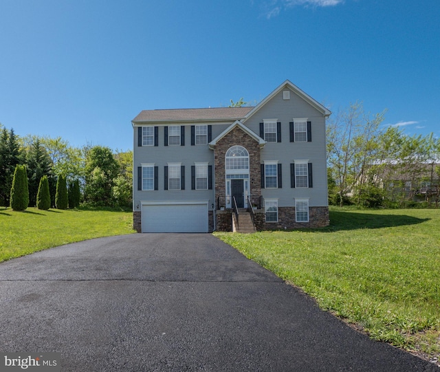 73 Marblehead Rd, Inwood, WV 25428 - split foyer home with a front yard, a garage, stone siding, and driveway