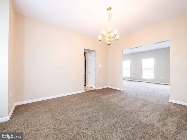 73 Marblehead Rd, Inwood, WV 25428 - carpeted spare room featuring a chandelier and baseboards