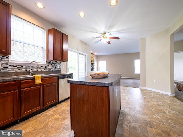 73 Marblehead Rd, Inwood, WV 25428 - kitchen featuring dishwasher, a sink, dark countertops, stone finish floors, and recessed lighting