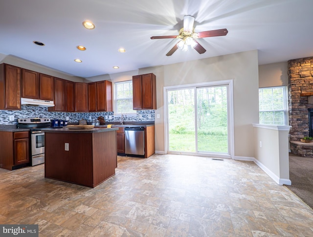 73 Marblehead Rd, Inwood, WV 25428 - kitchen featuring appliances with stainless steel finishes, under cabinet range hood, dark countertops, backsplash, and recessed lighting