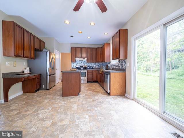 73 Marblehead Rd, Inwood, WV 25428 - kitchen with appliances with stainless steel finishes, under cabinet range hood, a sink, a kitchen island, and ceiling fan
