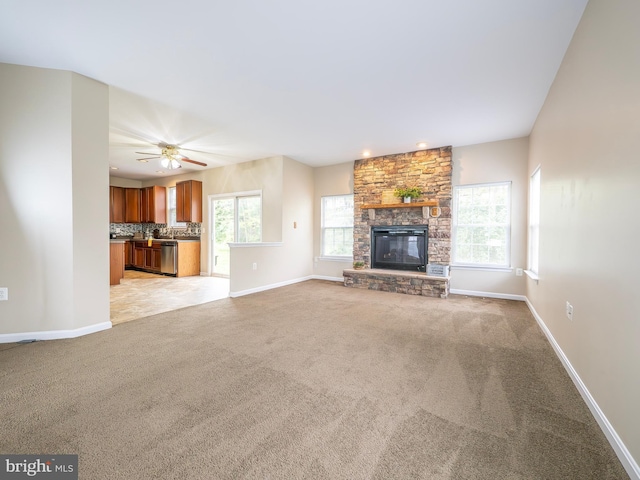 73 Marblehead Rd, Inwood, WV 25428 - unfurnished living room featuring light carpet, plenty of natural light, baseboards, a stone fireplace, and recessed lighting