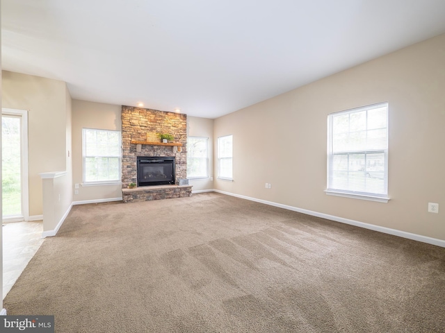73 Marblehead Rd, Inwood, WV 25428 - unfurnished living room featuring carpet, baseboards, and a fireplace