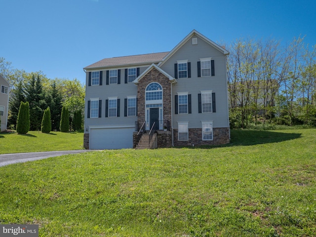 73 Marblehead Rd, Inwood, WV 25428 - view of front facade with driveway, a garage, stone siding, and a front yard