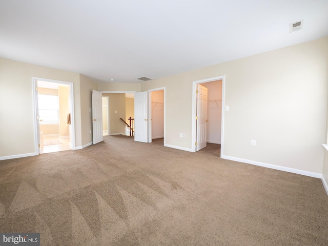 73 Marblehead Rd, Inwood, WV 25428 - unfurnished bedroom featuring carpet floors, baseboards, a spacious closet, and ensuite bathroom