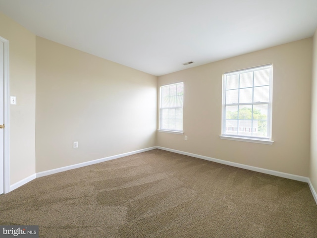 73 Marblehead Rd, Inwood, WV 25428 - carpeted spare room with plenty of natural light and baseboards