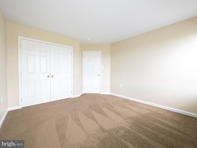 73 Marblehead Rd, Inwood, WV 25428 - unfurnished bedroom featuring baseboards, a closet, and carpet