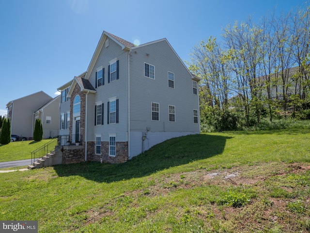 73 Marblehead Rd, Inwood, WV 25428 - view of home's exterior featuring stone siding and a lawn