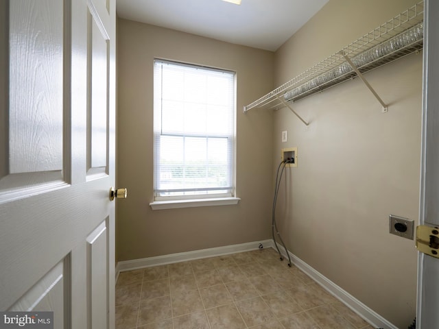 73 Marblehead Rd, Inwood, WV 25428 - washroom with electric dryer hookup, hookup for a washing machine, healthy amount of natural light, and baseboards